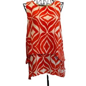 Michael Kors tank top size 6. Gold metal insignia at neck tiered orange/white.